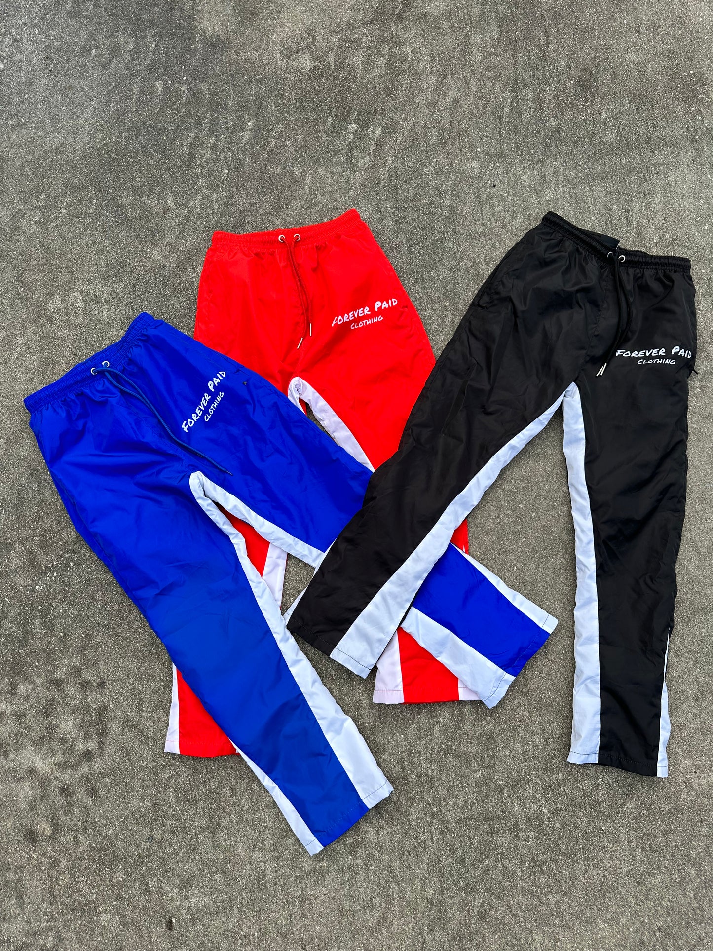 RED WINDBREAKER PANTS